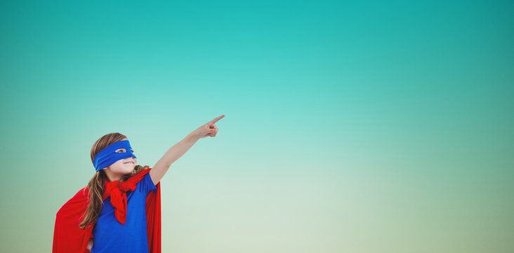 Composite image of masked girl pretending to be superhero