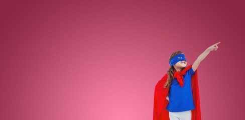 Composite image of masked girl pretending to be superhero