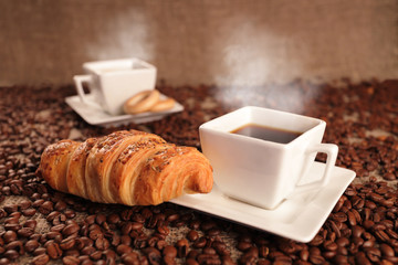 Coffee beans and croissant