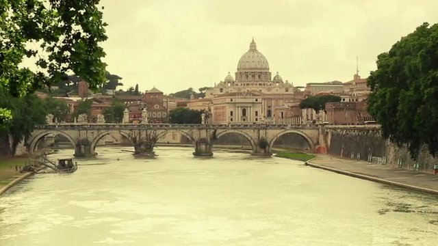 Pan shot of a river with a basilica in the background, St. Peter's Basilica, Tiber River, Rome, Lazio, Italy