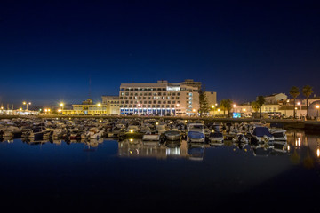 View of the peaceful marina of Faro city, Portugal at dawn.