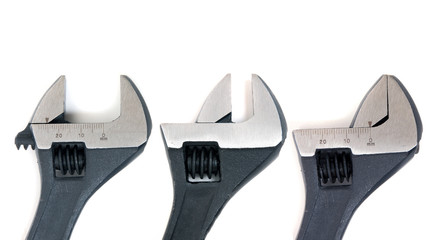 Close up view of an adjustable wrench isolated on a white background.