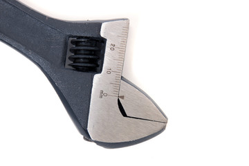 Close up view of an adjustable wrench isolated on a white background.