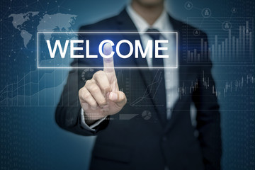 Businessman hand touching WELCOME  button on virtual screen