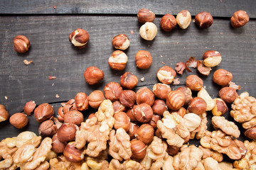 Assorted nuts in on wooden deck