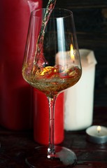 Pouring white wine into the wineglass