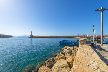 Fototapeta na wymiar Lighthouse at the port of Chania in Crete, Greece