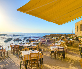 Traditional greek tavern by the sea in Chania, Greece - 102956542