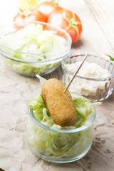 croquettes balls and different kind of sauces on a plate on a cl