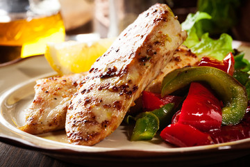 Grilled chicken breasts served with grilled paprika