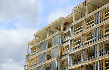 Construction site of residential building on blue sky background