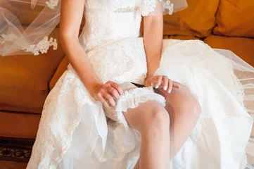Foto op Plexiglas beautiful bride's feet in shoes and white dress © ruslan_shramko