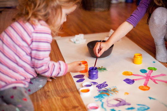 Two girls painting