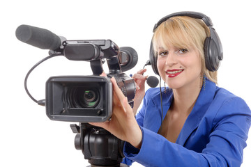 beautiful young woman with a professional video camera and headp