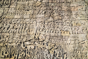 Fototapeta na wymiar Historic Khmer bas-relief showing Hindu legend scenes at Bayon temple