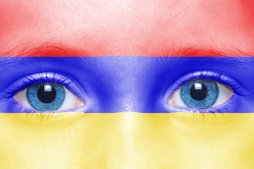 human's face with armenian flag