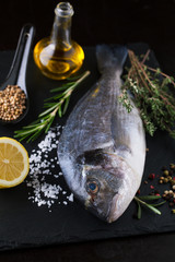 Fresh fish dorado with fragrant spices, herbs and spices
