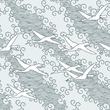 Japanese art inspired seamless pattern of gliding birds over the sea