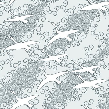 Japanese art inspired seamless pattern of gliding birds over the sea