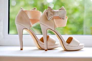 Sandals are a bride on the window