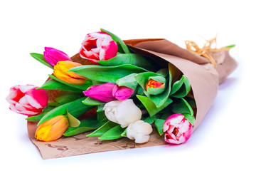the bouquet of tulips is wrapped in a paper isolated on a white