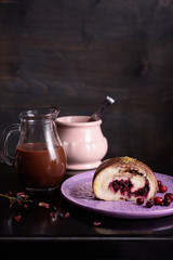 Hot chocolate drink and cranberry almond dessert, close up.