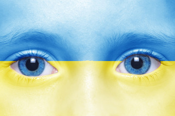 human's face with ukrainian flag