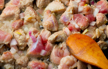 Start frying meat for goulash