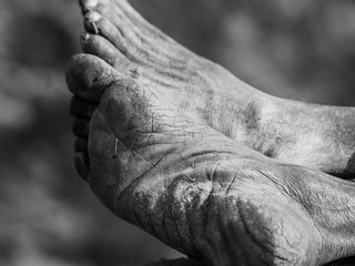Selective focus shot of feet of a very old man