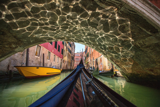 Fototapeta View from gondola during the ride through the canals of Venice i