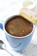 Coffee with milk for a breakfast.