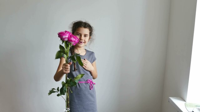 happy  girl teen gives roses flowers  