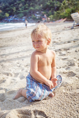 Portrait of little toddler on a beach