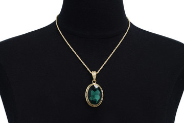 Trendy Oval Emerald Gemstone Necklace in an Ornate Yellow Gold Setting on a Bust