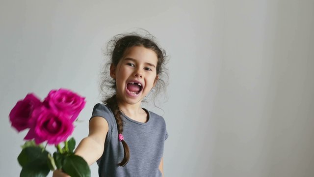 girl teen  gives flowers roses happy