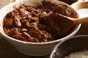Preparing dough for chocolate pie on table close up