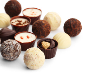 Assorted collection of chocolate candies and sweets, isolated on white