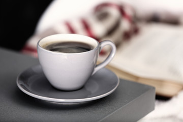 Cup of coffee on the kitchen table, close up