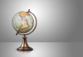 old style globe on gray background