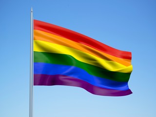 Rainbow 3d flag floating in the wind with a blue sky background