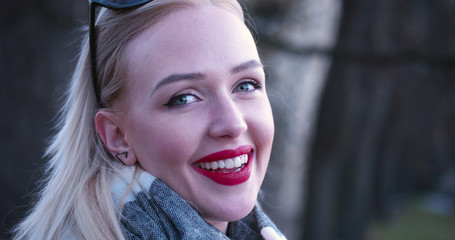 Beautiful blonde woman smiling to the camera