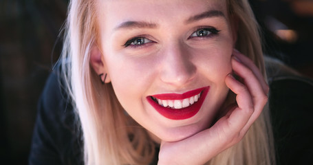 Beautiful blonde woman smiling to the camera