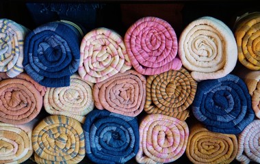 Colorful rolled silk scarves in Laos