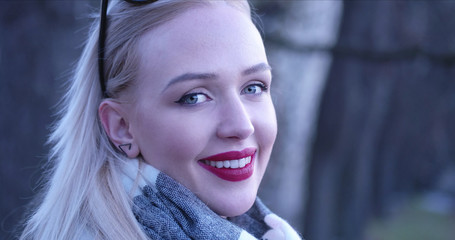 Beautiful blonde woman smiling to the camera