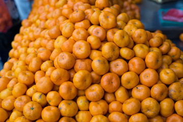 A food and fruit in Thailand’s street market with fresh goods and product doing daily. Day to day and a handwriting saying it is sweet and fresh.