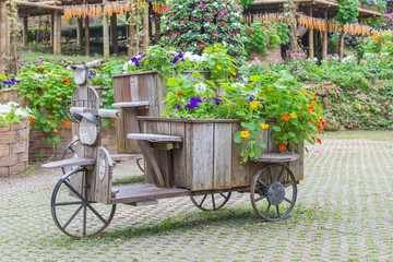 wood tray, motorcycle concept decoration in garden flowers