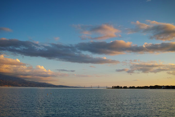 Fototapeta na wymiar Sunset over The cable bridge between Rio and Antirrio view from Nafpactos, Patra, Western Greece