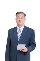 old Asian businessman in blue suit with digital tablet