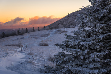 An amazing Sunrise on a bitter cold morning along the snow-covered Appalachian Trail in the Blue Ridge Mountains - 102974306