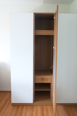 wood wardrobe furnishing in small room